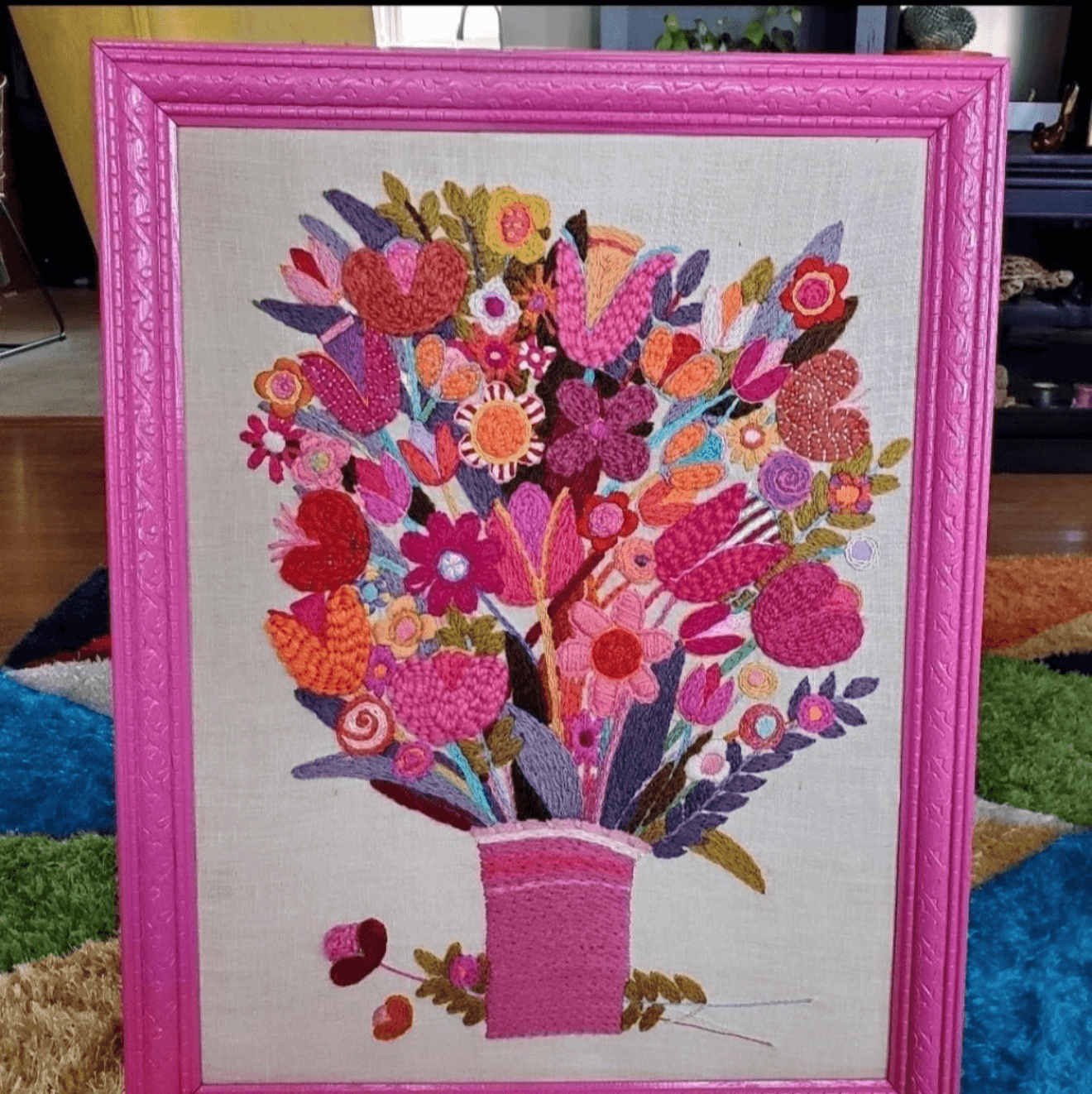 Vintage crewel embroidery floral bouquet in a hot pink custom frame